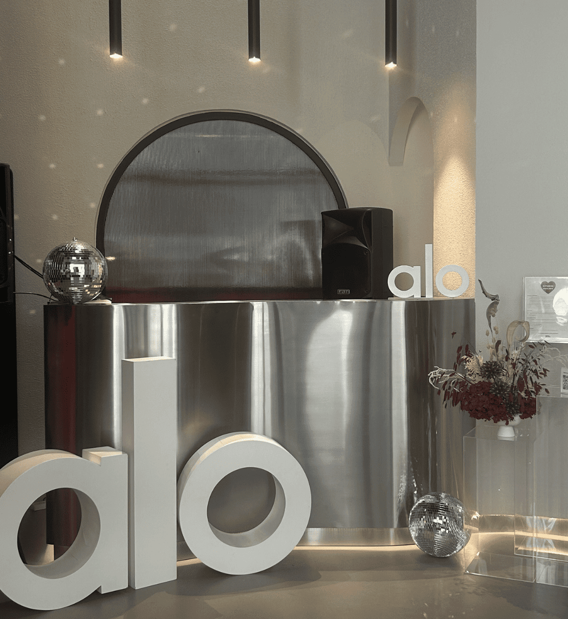Alo-branded BRRN BARRE reception installation
