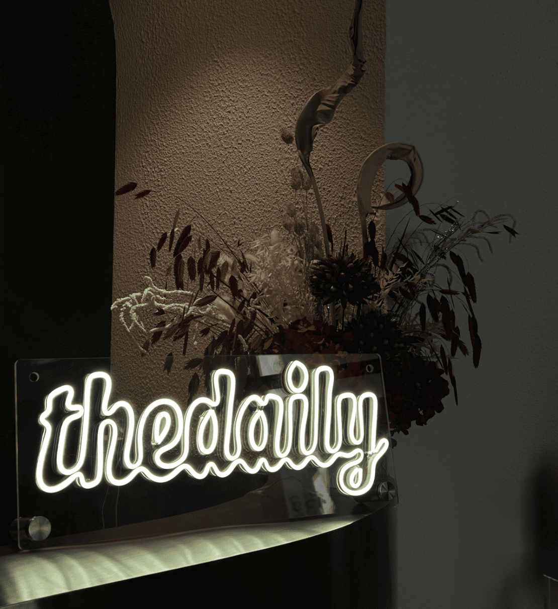 The Daily neon sign and floral event installation